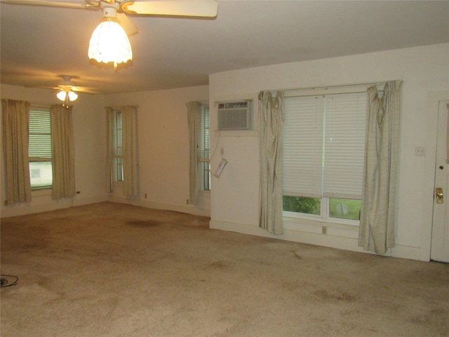101 E Murray St, Denison, TX 75021 - unfurnished room featuring a ceiling fan, a wall mounted AC, and carpet