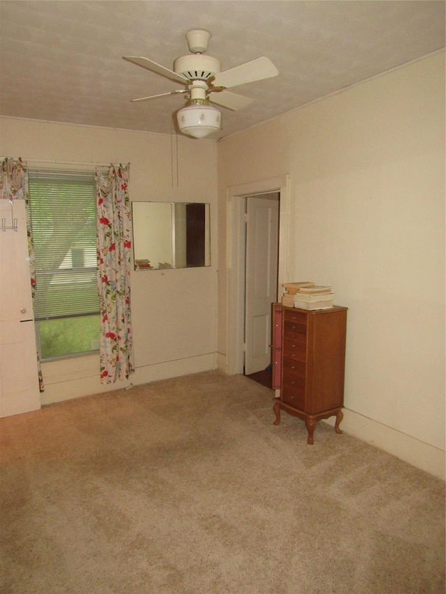 101 E Murray St, Denison, TX 75021 - spare room featuring carpet floors and ceiling fan