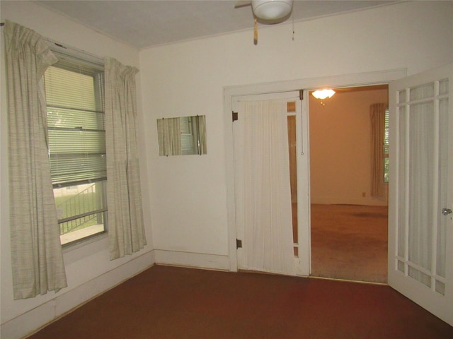 101 E Murray St, Denison, TX 75021 - unfurnished room with a ceiling fan and carpet floors
