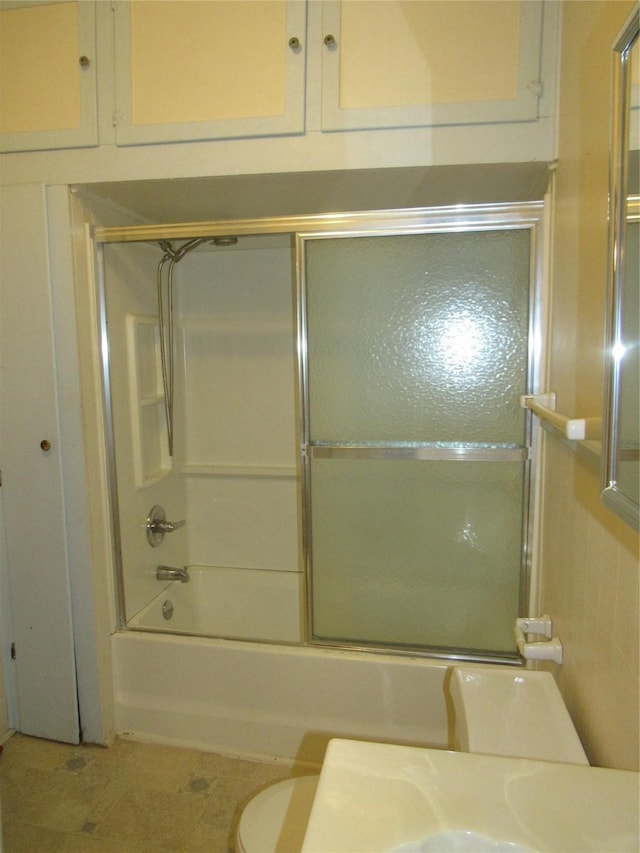 101 E Murray St, Denison, TX 75021 - full bathroom with enclosed tub / shower combo and toilet