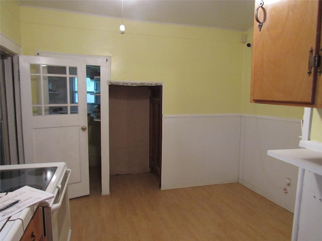 101 E Murray St, Denison, TX 75021 - kitchen featuring light wood-style flooring, wainscoting, and electric stove