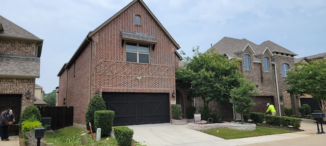 3805 Bentley Dr, Bedford, TX 76021 - view of front of property featuring brick siding, concrete driveway, an attached garage, and cooling unit
