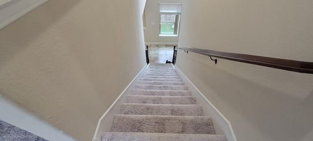 3805 Bentley Dr, Bedford, TX 76021 - staircase featuring baseboards and a textured wall