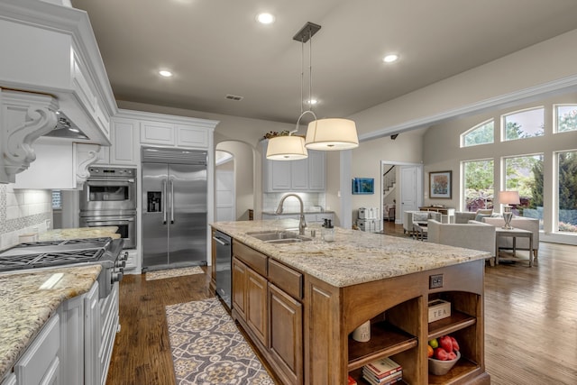 444 Francie Way, Allen, TX 75013 - kitchen with stainless steel appliances, a sink, tasteful backsplash, recessed lighting, and a kitchen island with sink