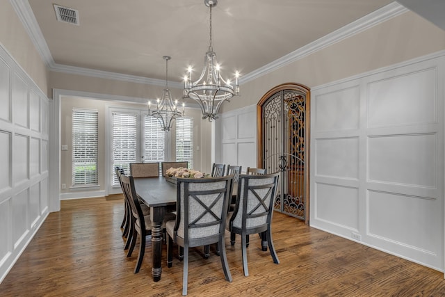 444 Francie Way, Allen, TX 75013 - dining area featuring a decorative wall, a chandelier, dark wood-style floors, and crown molding