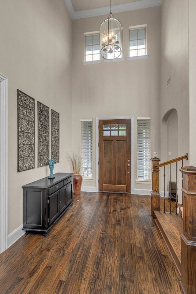 444 Francie Way, Allen, TX 75013 - foyer with a towering ceiling, dark wood-style flooring, a chandelier, crown molding, and baseboards