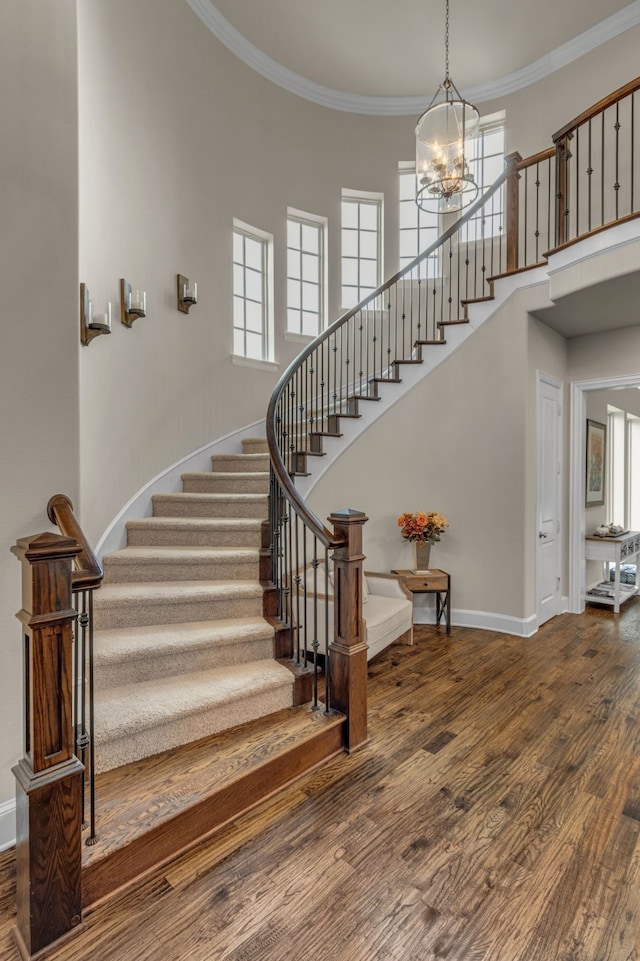 444 Francie Way, Allen, TX 75013 - staircase featuring a chandelier, baseboards, wood finished floors, a high ceiling, and plenty of natural light