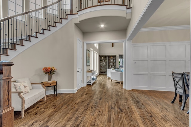 444 Francie Way, Allen, TX 75013 - foyer entrance with a decorative wall, wood finished floors, a high ceiling, stairway, and crown molding