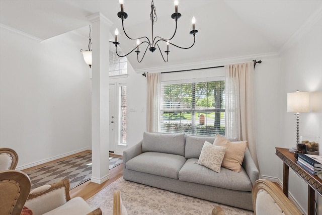 12303 Blue Ridge Dr, Frisco, TX 75033 - living room with healthy amount of natural light, ornamental molding, lofted ceiling, wood finished floors, and a chandelier