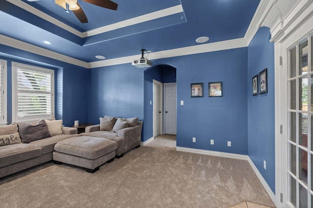 436 Valley View Ct, Aledo, TX 76008 - carpeted living room featuring crown molding, a ceiling fan, baseboards, arched walkways, and a tray ceiling