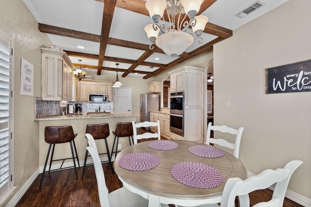 436 Valley View Ct, Aledo, TX 76008 - dining space with a chandelier, coffered ceiling, dark wood-style flooring, beamed ceiling, and arched walkways