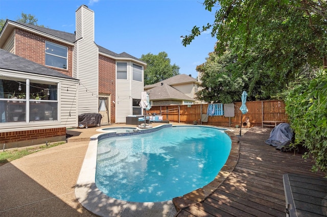 2804 Laurel Hill Dr, Flower Mound, TX 75028 - view of swimming pool with a fenced backyard, an in-ground hot tub, and a wooden deck