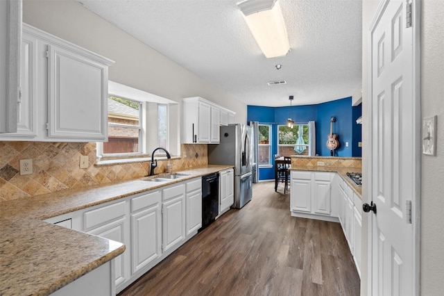 2804 Laurel Hill Dr, Flower Mound, TX 75028 - kitchen featuring a sink, black dishwasher, dark wood-style flooring, white cabinets, and a textured ceiling