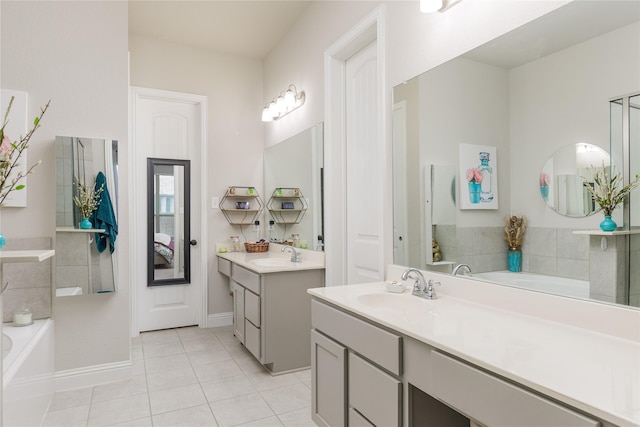 1909 Outpost Creek Ln, Aubrey, TX 76227 - full bath featuring a bath, tile patterned flooring, two vanities, and baseboards
