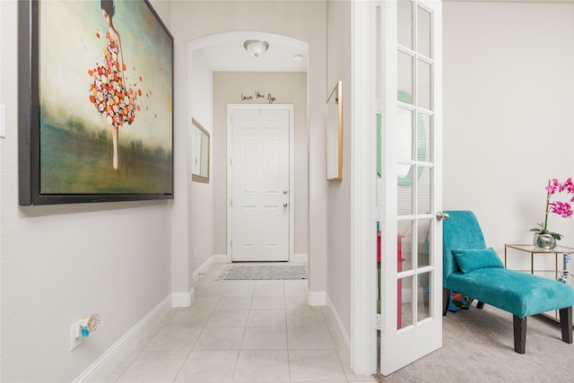 1909 Outpost Creek Ln, Aubrey, TX 76227 - corridor with baseboards, tile patterned flooring, and arched walkways
