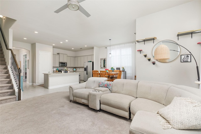1909 Outpost Creek Ln, Aubrey, TX 76227 - living area featuring stairs, ceiling fan, recessed lighting, light tile patterned flooring, and arched walkways