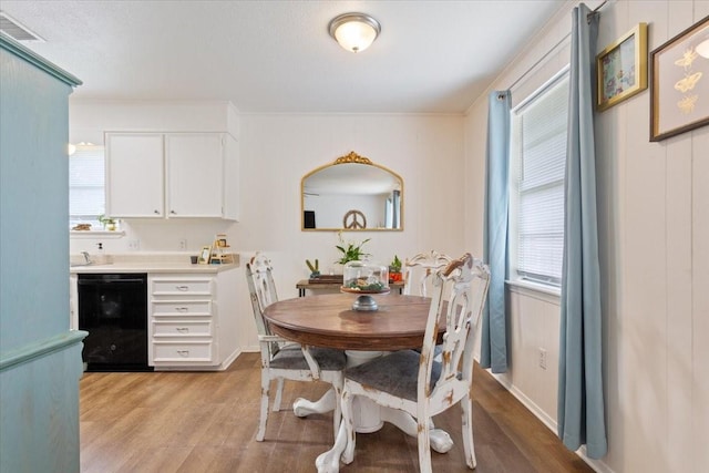 208 Alamosa Dr, Hewitt, TX 76643 - dining area featuring light wood-style floors, healthy amount of natural light, and ornamental molding