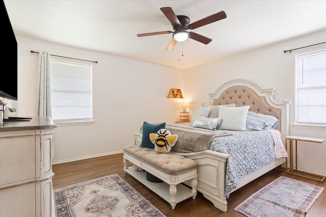 208 Alamosa Dr, Hewitt, TX 76643 - bedroom with multiple windows, wood finished floors, a ceiling fan, and baseboards
