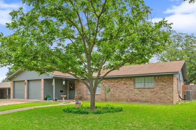 208 Alamosa Dr, Hewitt, TX 76643 - ranch-style house with central air condition unit, brick siding, concrete driveway, and an attached garage