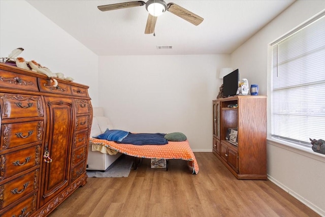 208 Alamosa Dr, Hewitt, TX 76643 - bedroom with light wood-style floors, baseboards, and a ceiling fan