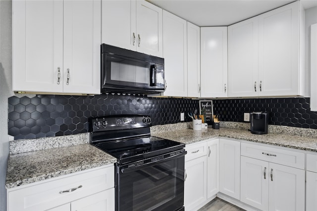 420 Fm 1528, Cooper, TX 75432 - kitchen with black appliances, white cabinets, light stone counters, and tasteful backsplash