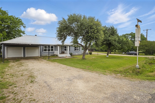 420 Fm 1528, Cooper, TX 75432 - ranch-style home with a front yard, driveway, and metal roof