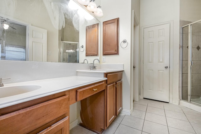 7108 Sugarplum Dr, Plano, TX 75074 - bathroom with tile patterned floors, a stall shower, and double vanity