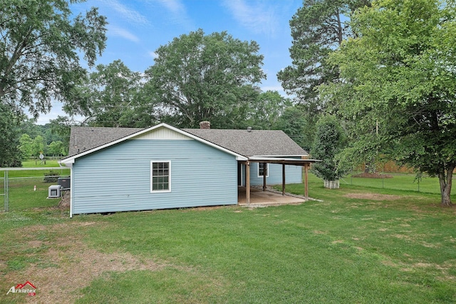 5630 Shreveport Blanchard Hwy, Shreveport, LA 71107 - back of property with a patio area, a shingled roof, and a chimney