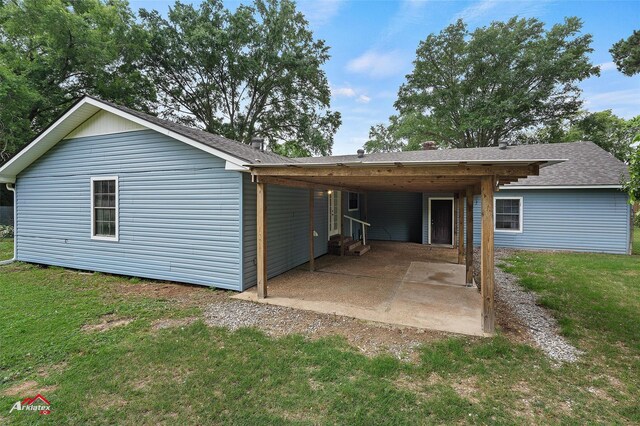 5630 Shreveport Blanchard Hwy, Shreveport, LA 71107 - back of property featuring a yard, a patio area, entry steps, and a shingled roof