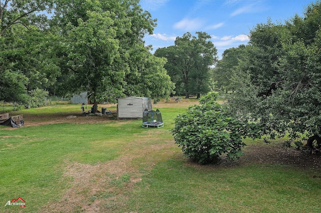 5630 Shreveport Blanchard Hwy, Shreveport, LA 71107 - view of green lawn featuring a trampoline