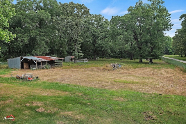 5630 Shreveport Blanchard Hwy, Shreveport, LA 71107 - view of yard featuring an outdoor structure, a pole building, and a forest view