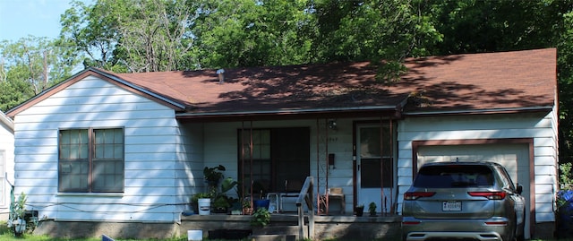 3809 Frederick Ave, Waco, TX 76707 - ranch-style house with a porch, a shingled roof, and an attached garage