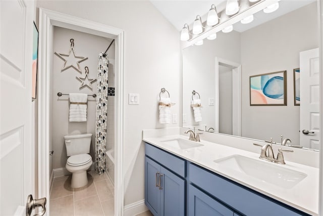 5312 Bordley Dr, Denton, TX 76207 - bathroom featuring toilet, tile patterned floors, double vanity, shower / bath combination with curtain, and baseboards
