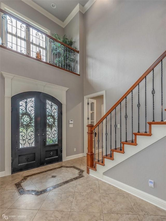 2549 Bloomfield Ln, Haughton, LA 71037 - entrance foyer with french doors, baseboards, healthy amount of natural light, ornamental molding, and a high ceiling