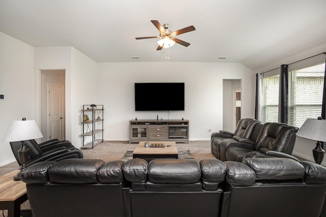 living room with ceiling fan and baseboards
