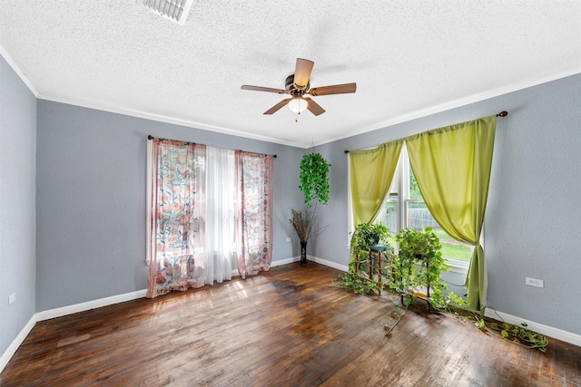 3801 Fort Ave, Waco, TX 76710 - unfurnished room featuring a ceiling fan, wood finished floors, crown molding, baseboards, and a textured ceiling