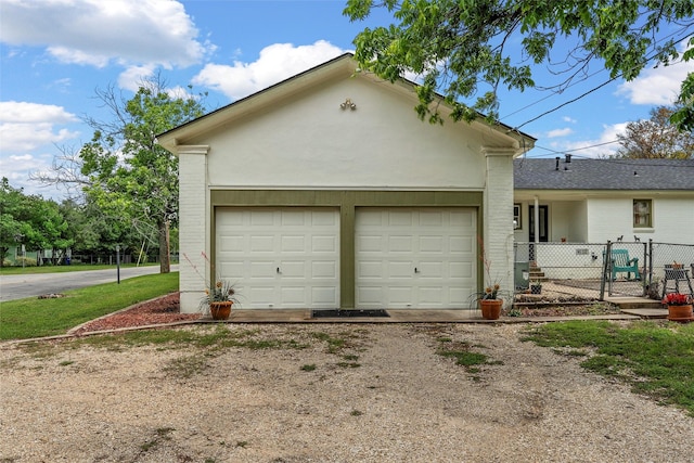 3801 Fort Ave, Waco, TX 76710 - garage featuring driveway and a gate