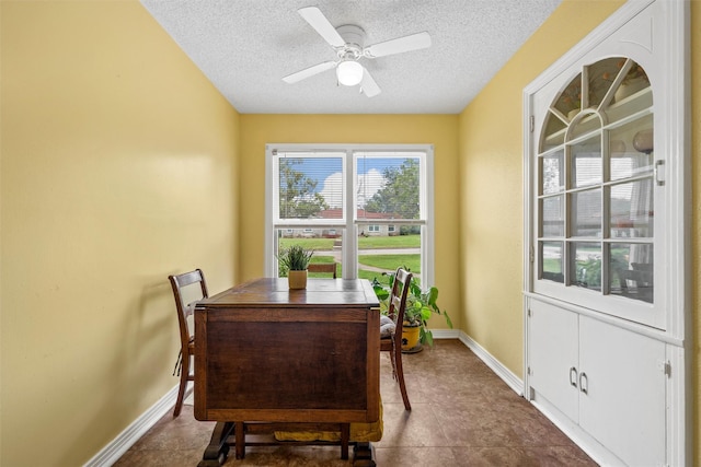 3801 Fort Ave, Waco, TX 76710 - dining room with a textured ceiling, a ceiling fan, baseboards, and an office area