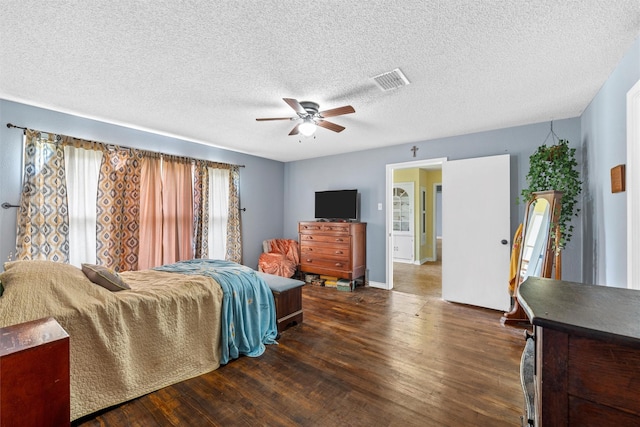 3801 Fort Ave, Waco, TX 76710 - bedroom featuring wood finished floors, ceiling fan, a textured ceiling, and baseboards