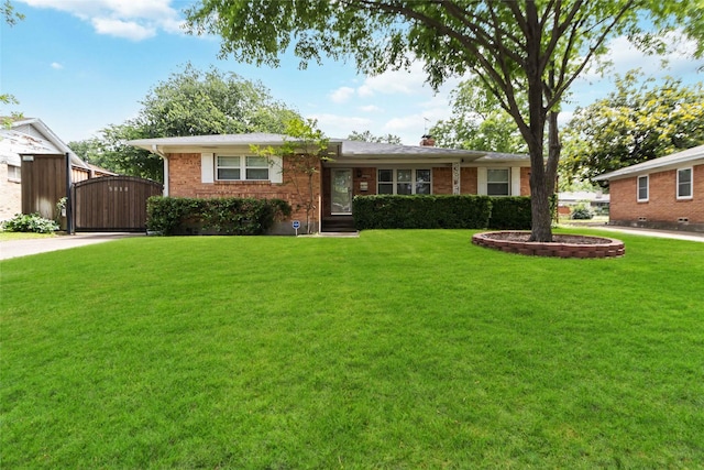 5818 Meadowick Ln, Dallas, TX 75227 - ranch-style home with a gate, a front yard, brick siding, and a chimney
