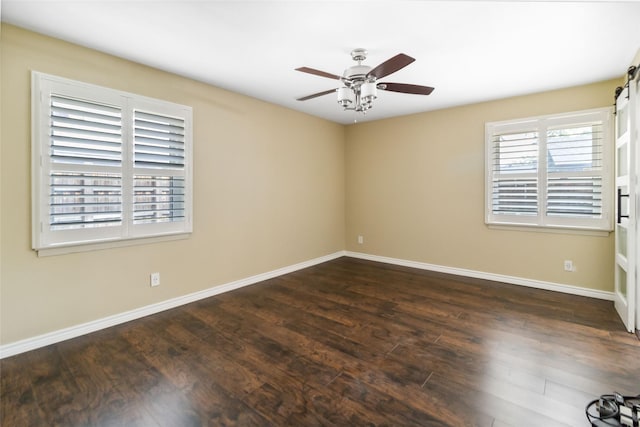 5818 Meadowick Ln, Dallas, TX 75227 - spare room with ceiling fan, dark wood-style flooring, and baseboards