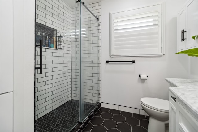 5818 Meadowick Ln, Dallas, TX 75227 - bathroom featuring a stall shower, toilet, vanity, and tile patterned flooring