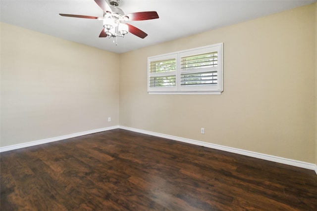 5818 Meadowick Ln, Dallas, TX 75227 - empty room featuring baseboards, dark wood-style floors, and a ceiling fan