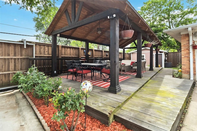 5818 Meadowick Ln, Dallas, TX 75227 - deck featuring outdoor dining area, a fenced backyard, and a gazebo