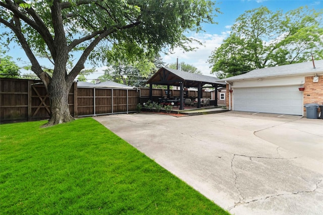 5818 Meadowick Ln, Dallas, TX 75227 - view of yard featuring a gazebo, driveway, and an attached garage