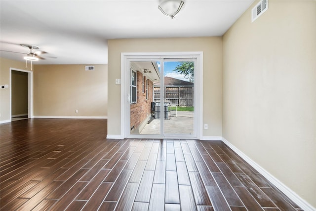 5818 Meadowick Ln, Dallas, TX 75227 - spare room with baseboards, wood finished floors, and a ceiling fan