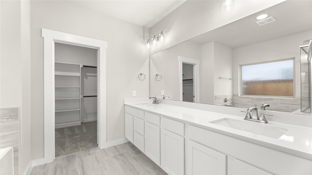 7522 Prairie Holly Ln, Midlothian, TX 76084 - full bath with a spacious closet, double vanity, and a bathtub