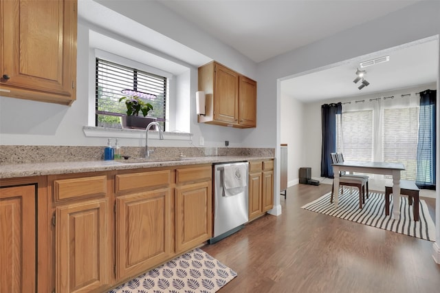 2434 Antler Trl, Lewisville, TX 75067 - kitchen with a sink, stainless steel dishwasher, dark wood finished floors, and plenty of natural light
