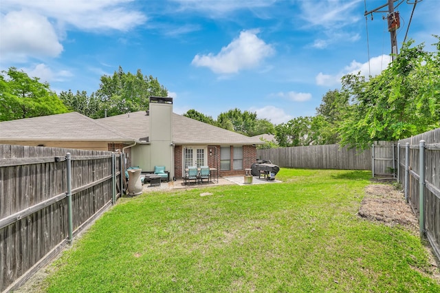 2434 Antler Trl, Lewisville, TX 75067 - back of property featuring brick siding, a patio, a chimney, and roof with shingles