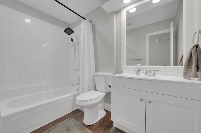 2434 Antler Trl, Lewisville, TX 75067 - full bath featuring wood finished floors, toilet, shower / bath combination with curtain, and vanity